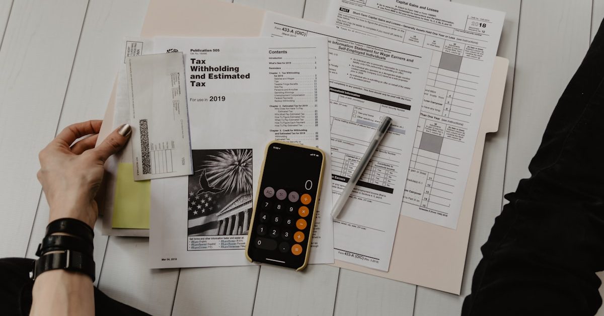 Financial analysis workspace — budget documents and calculator representing corrections spending analysis