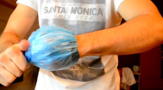 Demonstration of easy wrist-worn electronic monitor removal showing security vulnerability of hand-worn supervision devices