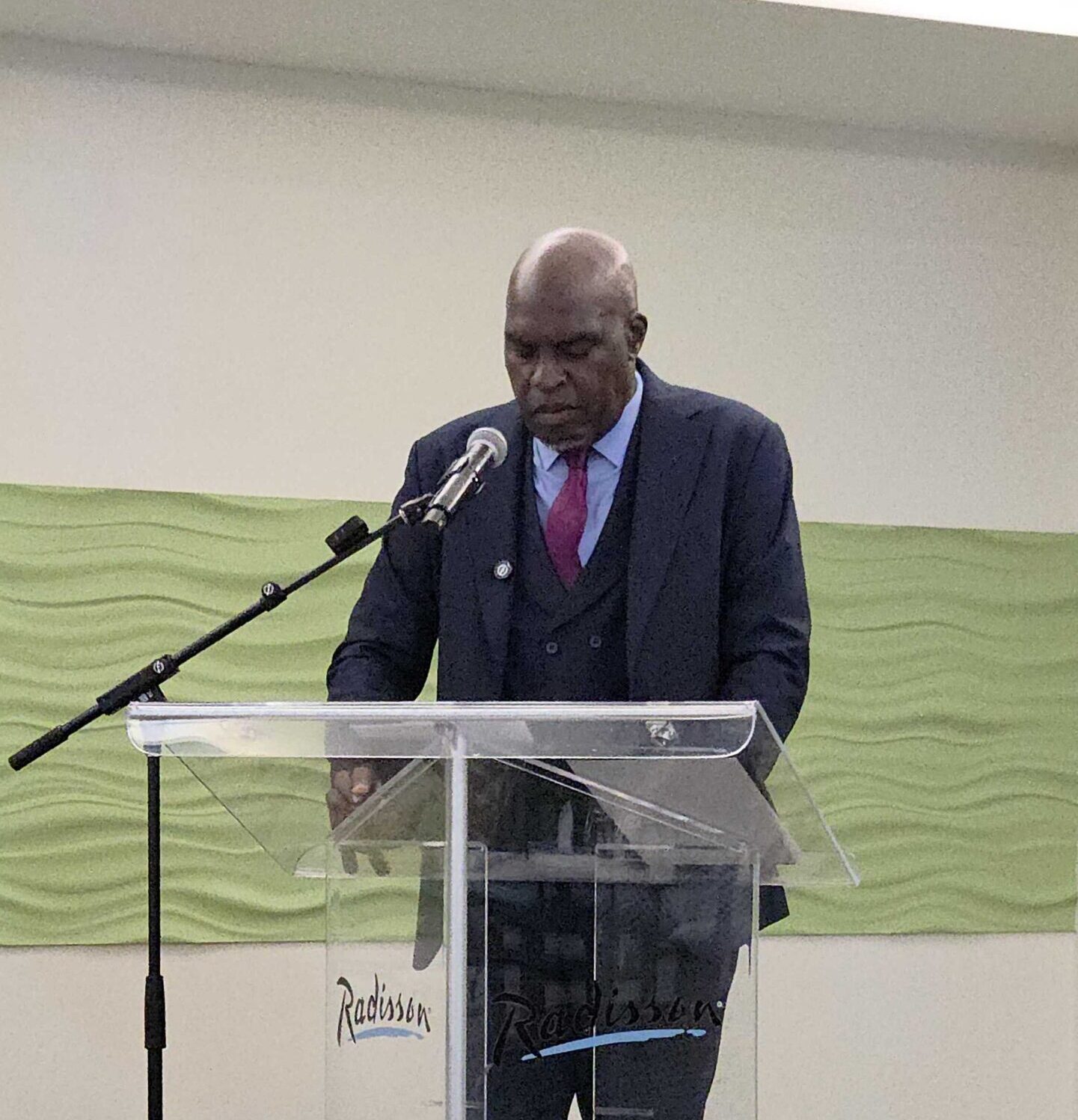 Minister of Legal Affairs and Criminal Justice Michael Lashley speaking at the National Consultation on Victims and Victim Support